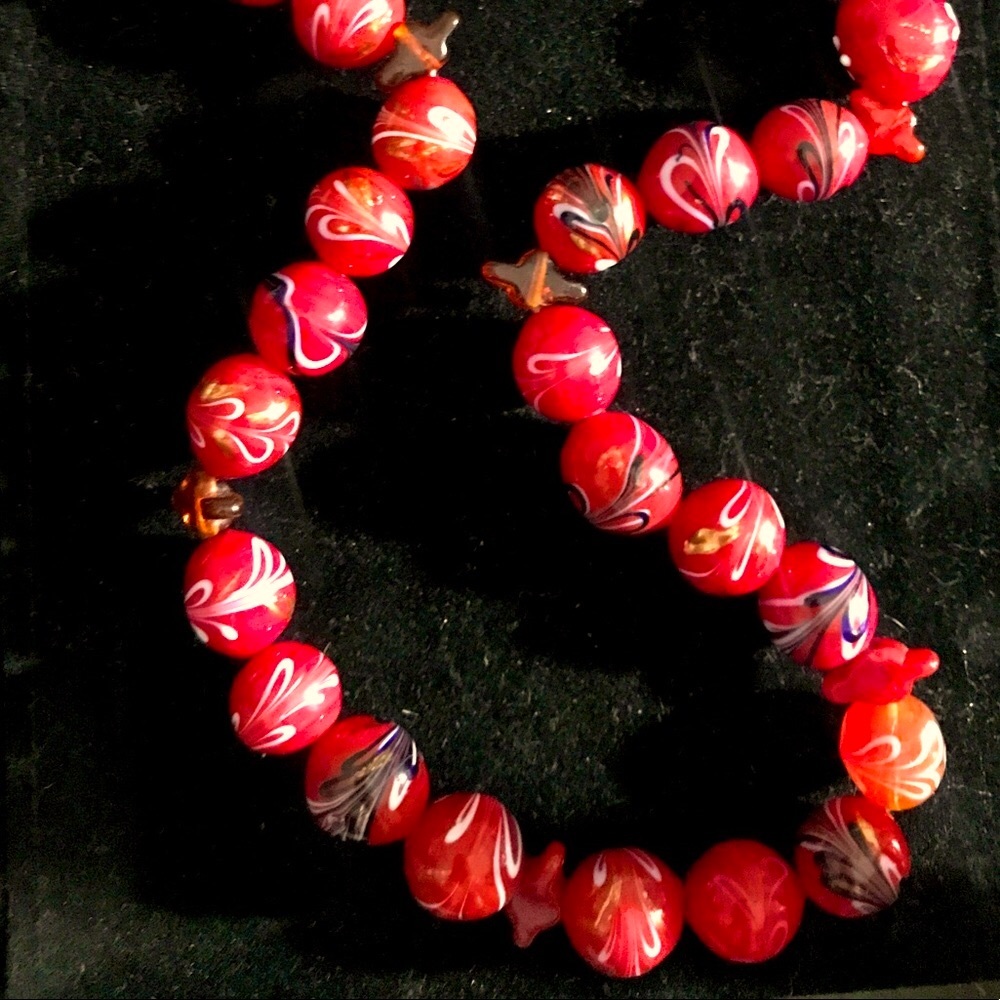 Red blown glass necklace.